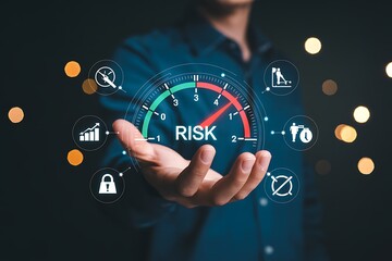 Businessman adjusting risk management gauge