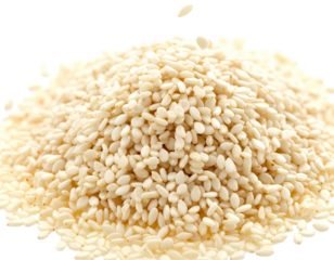 A close-up view of a pile of white, oval-shaped seeds, some falling from above, on a black backdrop