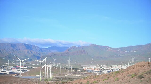 Sustainability in Motion: 4K Aerial of Passenger Aircraft Landing over the Arinaga Offshore Wind Farm and Renewable Energy Infrastructure, Gran Canaria, Spain