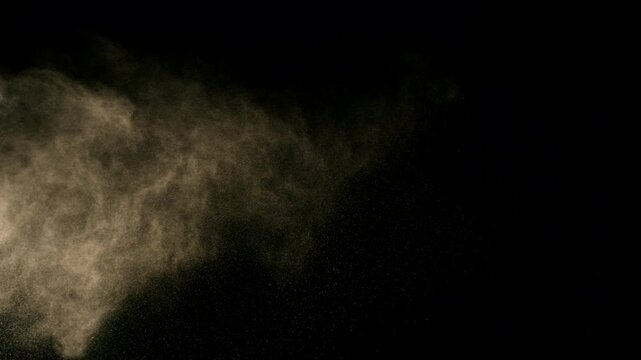 Super Slow Motion Shot of Flying Sand Powder , Isolated on Black Background , Filmed on High Speed Cinematic Camera at 1000 FPS