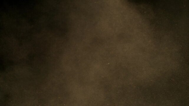 Super Slow Motion Shot of Flying Sand Powder , Isolated on Black Background , Filmed on High Speed Cinematic Camera at 1000 FPS