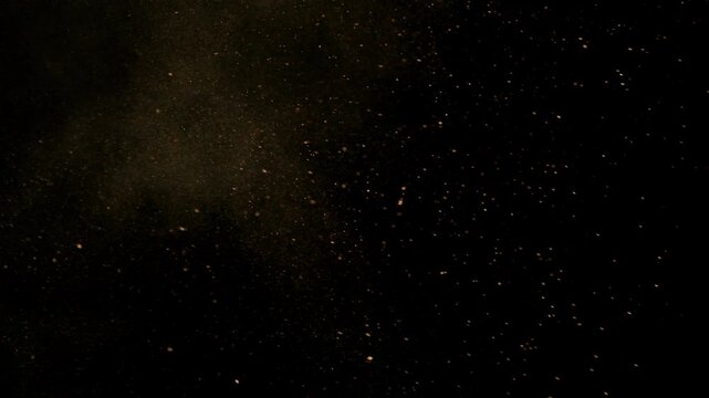 Super Slow Motion Shot of Flying Sand Powder , Isolated on Black Background , Filmed on High Speed Cinematic Camera at 1000 FPS