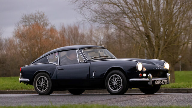 Milton Keynes,Bucks,UK - Jan 1st 2026:  1968 Triumph GT6 classic car driving on a British road