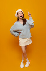 Advertising banner promotion concept with Asian woman pointing at empty copy space to highlight marketing message call to action creative content placement for digital campaigns.