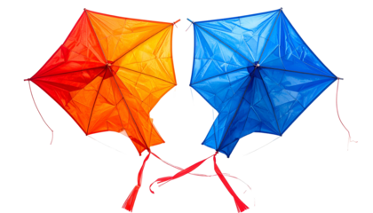 Two vibrant, diamond-shaped objects in red, orange, and blue. Ribbons attached. Black background