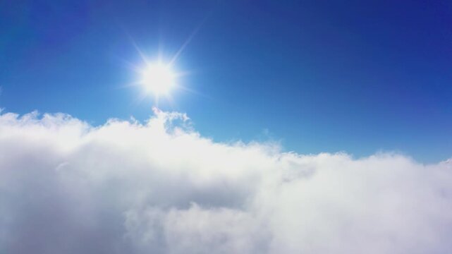 Wonderful view of extraordinary cloudy valley and bright orange sunset