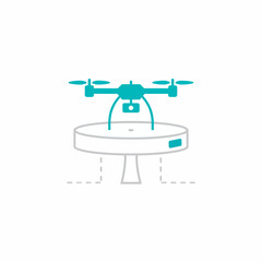 Drone hovering above a circular docking station or platform on a stand