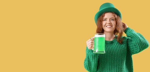 Young redhead woman with beer on yellow background with space for text. St. Patrick's Day celebration