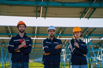 Engineers are working at solar farm.