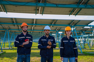 Engineers are working at solar farm.