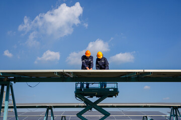 Engineers are working at solar farm.