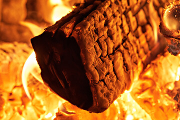 Close-up of a hearth. Wood burning in a rustic stove. Photo taken with a long exposure.