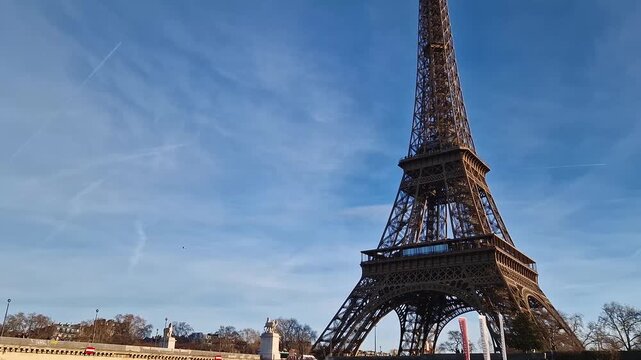Paris, France - December 10, 2025: View from a cruising boat trip along the Seine river to the breathtaking Eiffel Tower. The iconic Parisian landmark as global attraction. French trip symbol
