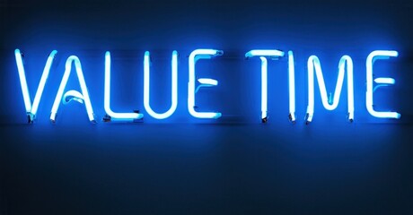 Bright neon sign displays words Value Time. Blue glow contrasts dark background. Simple message, motivational feel.
