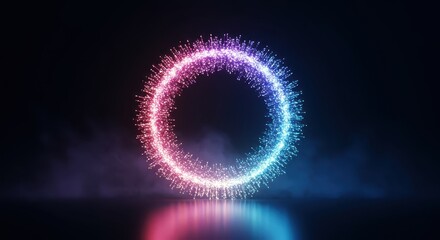 Glowing particle ring structure displays vibrant pink and blue illumination against a dark background