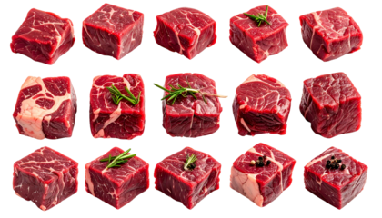 Fifteen raw, cut beef cubes, some garnished with herbs or peppercorns, isolated on black