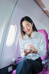 A young Asian woman, a passenger on the plane, embarks on a study abroad journey, representing cultural exchange and academic experiences in international education.