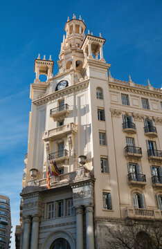  Old building with clock and tower magnificent building Casa del Chavo in Valencia, Spain. Ornate architecture, historical monument, city center, Spanish heritage.