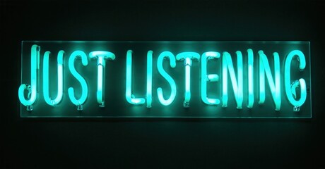 Bright neon sign displays text Just Listening. Dark background emphasizes glowing turquoise illumination. Simple, direct message.