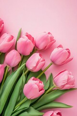 Obraz premium Spring flowers bouquet of pink tulips arranged on a pastel pink background for special occasions and celebrations like Valentine's Day and Mother's Day