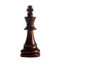 Fototapeta premium A regal, dark-wood chess king piece isolated against a plain black background, offering contrast