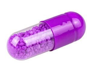 A close-up of a purple and clear capsule filled with numerous small, round granules, isolated