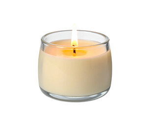 Glowing candle in a clear glass container against a black background