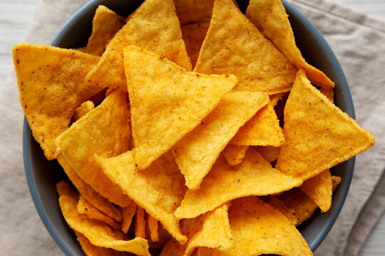 Nacho Chips with Cheese Flavor in a Bowl, top view.