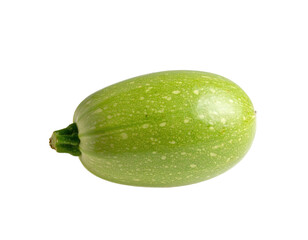 A single, pale green zucchini against a stark black background, showcasing its texture