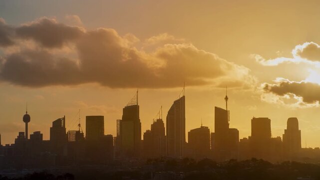 Panoramic Silhouette of Sydney City Skyline at Sunset with Iconic Landmarks and Golden Sky