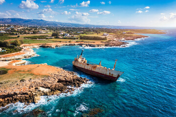 Abandoned Edro III Shipwreck at seashore of Peyia, near Paphos, Cyprus. Historic Edro III Shipwreck site on the shore of the water in Cyprus. Aerial view of Shipwreck EDRO III, Pegeia, Paphos.