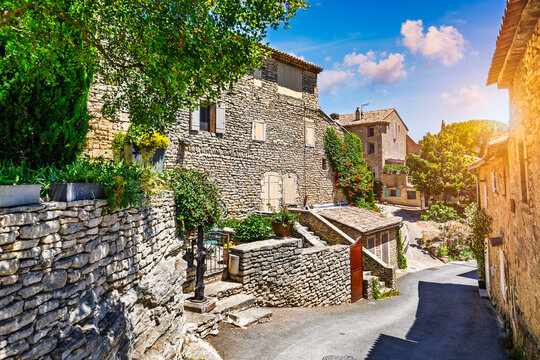 View of Goult, a small typical town in Provence, France. Discover the stunning hilltop village of Goult in Provence on a sunny day. Ancient hilltop village of Goult, Provence, France.