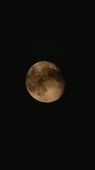 Obraz premium The brightest and largest object in our night sky, the Moon makes Earth a more livable planet by moderating our home planet's wobble on its axis, leading to a relatively stable climate. It also causes