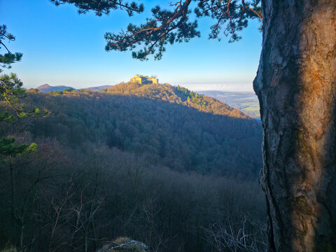 Germany, Hohenneuffen castle ruins, mountain summit at neuffen village surrounded by nature landscape, winter season, fog covering the valley scenery, early morning sunrise mood