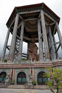 Majestic view of Kek Lok Si Temple featuring the towering Guanyin Pavilion and traditional pagoda architecture in Penang, Malaysia. 