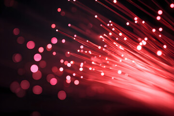 Vibrant display of pink light trails and dots shining against a dark background