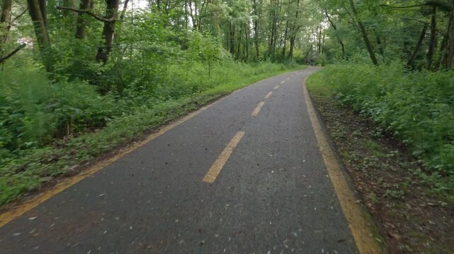 Cycling on the cycle path that connect Cuveglio to Luino, Varese, Italy