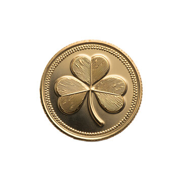 A golden coin featuring a detailed four leaf clover design on a black background