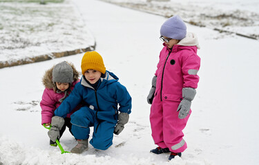 three siblings on winter day