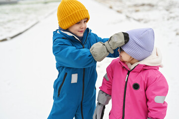 three siblings on winter day