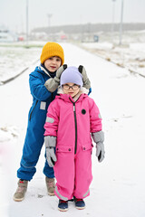 three siblings on winter day