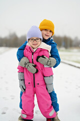 three siblings on winter day