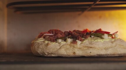 Watch as we prepare delicious Roman pizza from scratch in a classic oven. Every step captures the rich flavors and textures unique to this culinary art. Join us in this exciting cooking journey.