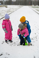 three siblings on winter day
