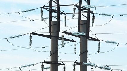 Electricity pylons transporting energy in crimea with glass insulators and power cables crossing...