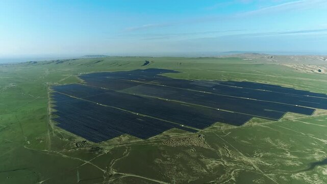 Aerial drone view of photovoltaic solar power plant station renewable energy electricity. Solar panel fields demonstrating renewable energy innovation.