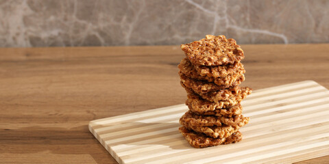 kozinaki made from peanuts. sweet snack, broken pieces of dessert made from nuts. empty space for...