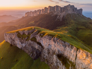 Above view of national park Bolshoy Tkhach in Caucasus with dolomite mountains and sunset