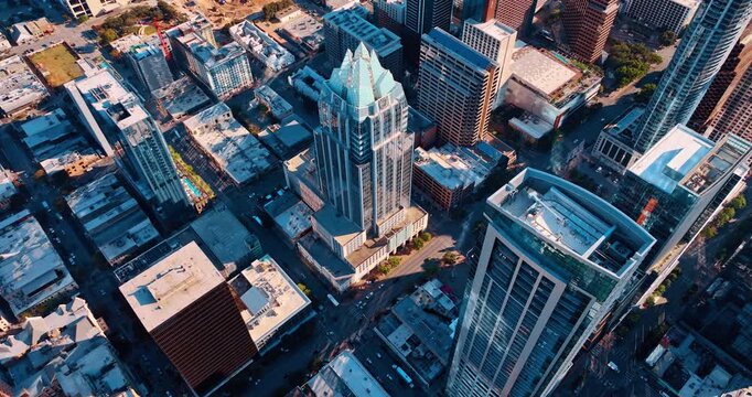 Distancing from gorgeous Frost Bank Tower in the downtown of Austin, Texas, USA. Top view on high-rises, low-rise buildings and construction site in city scenery.