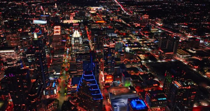 Footage over the dazzling scenery of Austin, Texas, USA at night. Panorama of lively vibrant city from drone.